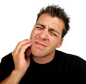 Man in pain and in need of an emergency dentist.